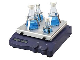 Třepačka SKO-D XL LINEAR s perforovaným nástavcem a pružinovými svorkami pro uchycení baněk. Nástavec i svorky se objednávají samostatně.