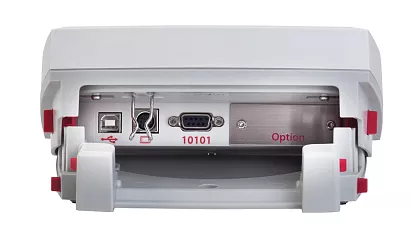 Zadní strana displeje. Rozhraní RS232, USB host pro připojení k PC nebo tiskárně, vstup pro propojovací kabel se základnou váhy.